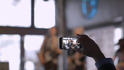 Man takes smartphone video of young band playing in Austin bar during South By Southwest music festival Stock Footage