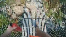 Hiking over the bridge Stock Footage