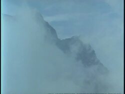 WA clouds obscuring dark mountain top, Uganda, Africa Stock Footage