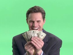 CU, Happy businessman holding fan of American dollar banknotes in studio, portrait Stock Footage