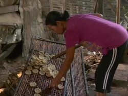 ZO Woman making rice cakes / Luang Prabang, Laos Stock Footage
