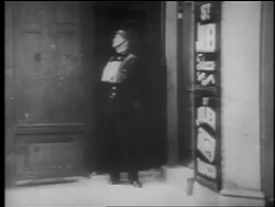 B/W 1940 soldier standing in doorway looking to side, flinches + steps back / London Blitz / educ. Stock Footage