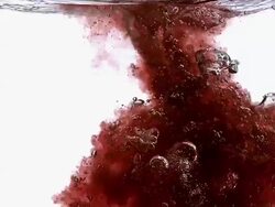 MS SLO MO Red liquid entering into water against white background / Vieux Pont, Normandy, France  Stock Footage