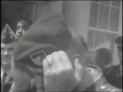 Lieutenant Charles Williams puts on the Green Beret in a Medal of Honor ceremony. News Clip