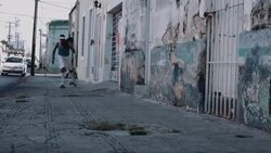 Young adult male rollerblade in urban street Stock Footage
