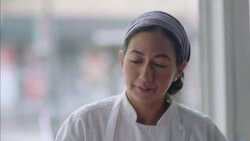 Pastry chef places cake on tray and decorates with icing bag Stock Footage