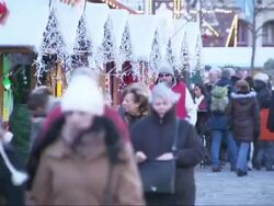 People enjoying a Christmas market in Brussels News Clip