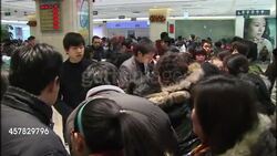 Shoppers looking at gold jewellery in shop News Clip