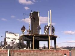 Construction workers erect a water tank in a time lapse for the Salvation Army in New York. Stock Footage