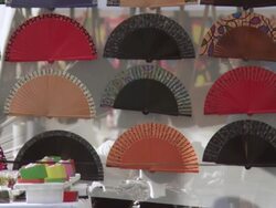 MS Shot of Typical Spanish's fan store and people passing by / Barcelona, Catalunya, Spain Stock Footage