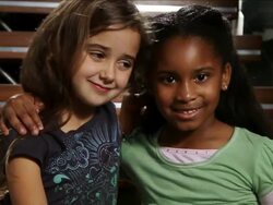 CU Curly haired girl and African American girl hugging and smiling / Miami, Florida, United States  Stock Footage