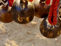 CU PAN Shot of Himalayas livestock and animal bells hang for sale at merchant shop in Namche Bazarre / Namche, Nepal Stock Footage