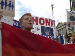 2009 MS TD TU Young man and young woman holding rainbow flag and shouting slogan at a same-sex marriage rally outside San Francisco City Hall/ San Francisco, California, USA/ AUDIO Stock Footage