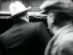 B/W 1931 REAR VIEW Al Capone entering car Stock Footage