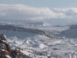 MS T/L View of Fresh Snow on Red Rock Desert, Natural Arch / Moab, Utah, United States Stock Footage