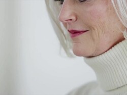 CU tilt down senior woman using laptop Stock Footage