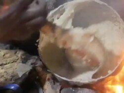 Woman stirring pastry of Ethiopian dish Stock Footage