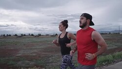 Physically Fit Caucasian Couple in their Thirties Running Stock Footage