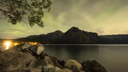 Time lapse view of aurora borealis and night sky, mountain lake Stock Footage