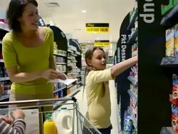 Mother and children shopping in supermarket Stock Footage