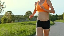 SLO MO TS Female marathon runner running in countryside Stock Footage