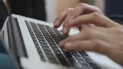 typing on a laptop Stock Footage