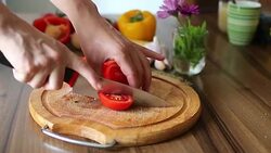Female hands cutting tomato Stock Footage