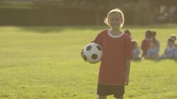 Children playing soccer Stock Footage