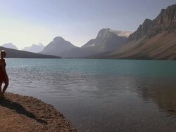 WS, couple at Lake Bow edge, Banff National Park, Alberta, Canada Stock Footage