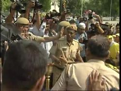 Tibetans carrying symbolic Olympic torch hold protest march News Clip