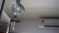 Infusion bottle with IV solution to help patient Stock Footage