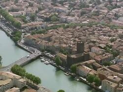 MS AERIAL TS Shot of castle in Agde city with houses / Languedoc Roussillon, France Stock Footage