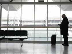 MS Middle aged businessman using cellular phone inside airport / Minneapolis, Minnesota, United States Stock Footage