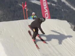 A skier doing a jumping trick on skis in the winter at a ski resort. - Slow Motion Stock Footage