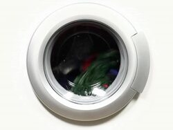 Washing machine with colorful laundry / PAL Stock Footage