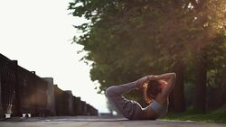 Young Woman Doing Yoga Meditation Exercises at Sunset Stock Footage
