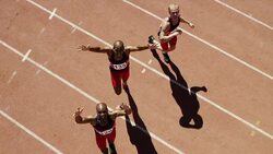 Portrait of male runners celebrating on track Stock Footage