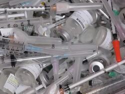 ECU PAN Empty Medication Bottles and Syringes in Medical Waste Bin / Richmond, Virginia, USA Stock Footage