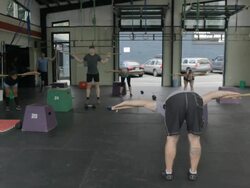 Wide frame. Dustin leads class in dowl stretch. Stock Footage