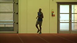 Nathan Douglas training on an indoor running track. News Clip