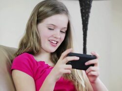 Pretty young teenage girl sending text message Stock Footage