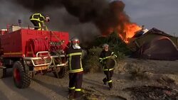 Fires Started In Calais Migrant Camp During Evacuation News Clip