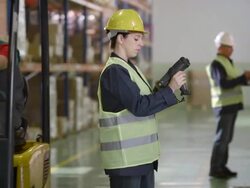 Female Warehouse Employee Scanning Boxes Stock Footage