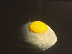 Frying an Egg (Bull's Eye) Stock Footage