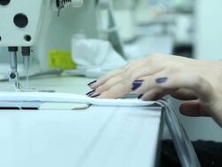 Female tailor working on sewing machine in factory Stock Footage