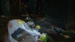 Trash and garbage pollutes Bourbon Street in New Orleans. Stock Footage