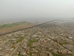WS AERIAL View of rooftops of township freeway under water / Lagos, Nigeria Stock Footage