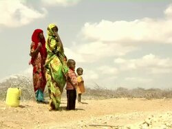 Refugee family on roadside Stock Footage