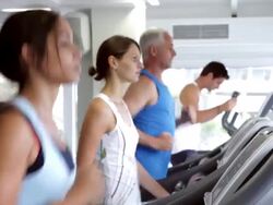 Group Of People Using Running Machines Stock Footage