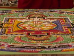 WS ZI  Process of destroying  sand mandala is begun and the sand  pushing towards to center of  table  / Kathmandu, Central, Nepal Stock Footage